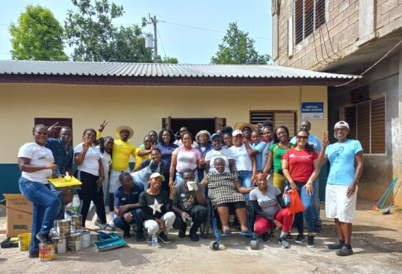 Team members from Sandals Montego Bay and Sandals Royal Caribbean pose with Central Basic School’s principal Mrs. Esmine Richards - Peterkin (center).   