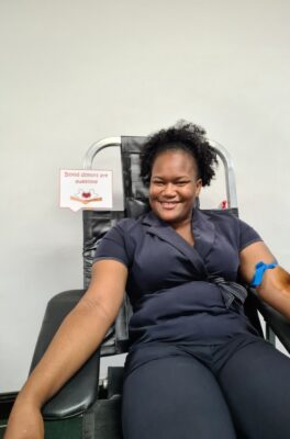 Sandia Hutchinson, Wedding Coordinator at Sandals Negril shared a smile with the camera as she made herself comfortable before her blood donation.