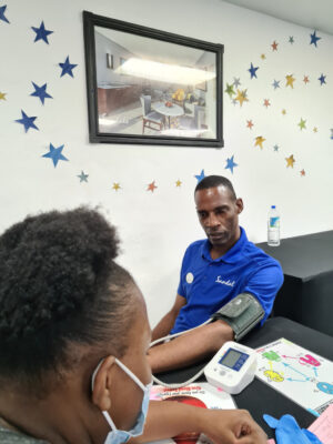 Housekeeping Supervisor at Sandals Negril, Garfield Brown sat patiently and listened keenly as he got his blood pressure taken.