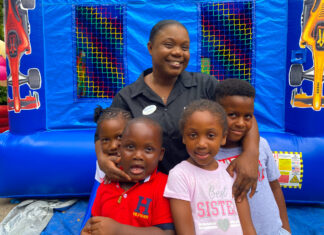Debbian Anderson from the Beaches Negril stewarding team posed for a quick picture with her children as they got ready to join in on the fun at the resort’s family fun day.