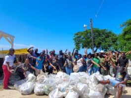 The team pauses for a quick photo with the over 40 bags of garbage which they collected on International Coastal Cleanup Day.