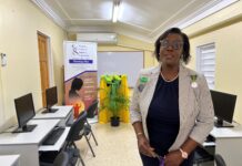 Dawn Smith, General Manager of Sandals Royal Caribbean, representing the Sandals Foundation, showing off a section of the newly refurbished computer lab at the Women’s Centre of Jamaica in Montego Bay.