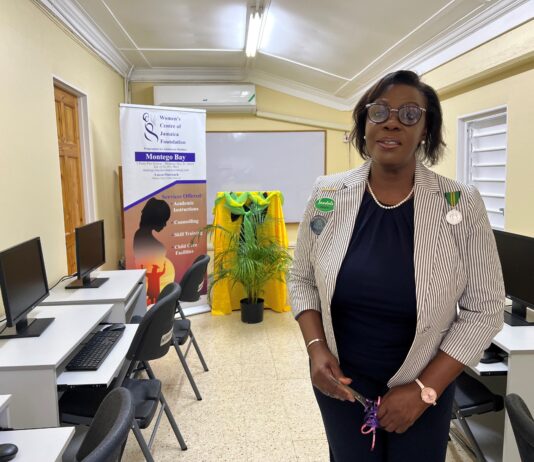 Dawn Smith, General Manager of Sandals Royal Caribbean, representing the Sandals Foundation, showing off a section of the newly refurbished computer lab at the Women’s Centre of Jamaica in Montego Bay.