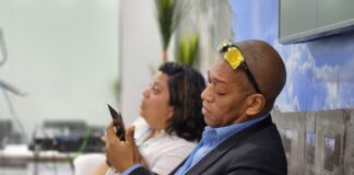 Dr Mark Bynoe and colleague at the Caribbean Community Climate Change Centre, Ethlyn Valladeres, take a breather in the Caribbean Pavilion at the UN Climate Talks which got underway in Egypt today (Monday, November 7, 2022).