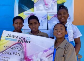 (From left) Broughton Primary School students Amari Whyte, Rodger Williams Anise Anderson and Jordan Subaxon were elated to receive fans for their classrooms donated by the Sandals Foundation.
