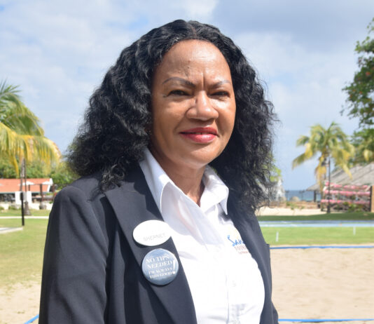 Shernet Bailey (left) manager at the Sandals Central Laundry and Assistant Manager Sonita Danhi pause from their leadership duties as they share a moment with the camera