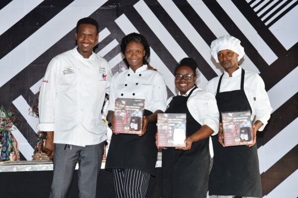 (From left) Executive chef at Sandals Negril, Delroy Haye, shares the lens with ‘Make it Happen’ team members  Abi- Joan Allen, Kedesha Spence and Yakini Scott who walked away with second place in the departmental cook-off.