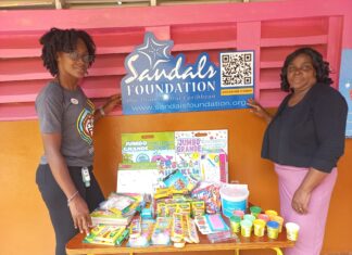 After handing over donations, Joy pauses to share lens time with a smiling Christene Dennis, Principal of the Windsor Basic School in Siloah, St Elizabeth.