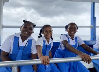 Grade 4 students (from left) Akayla Forrester, Tessania Tulsie and Sonia Spence from Broughton Primary School, Westmoreland shared bright smiles for the camera as they headed to sea with the Beaches Negril watersports team for a glass bottom boat tour and lessons on different types of sea creatures and the importance of taking care of the ocean.