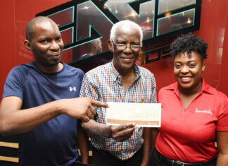 Sharing smiles at the prize handover for the Sandals Resorts International and EDGE FM Soulful Dad competition are (l-r) Dwight Hewitt, son of Trevor Hewitt, Trevor Hewitt, winner of the competition and Jennese Palmer, Public Relations Manager at SRI. Hewitt has won for himself an all-inclusive luxury weekend for 4 at any local Beaches Resort in honour of being an amazing father.