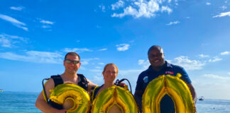 (From left) Diving couple Norman and Tracy Krobath proudly celebrates their diving milestones with Sandals Negril’s scuba instructor Sangha Spencer who led their excursions.