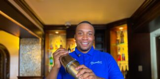 Beach Negril Bar Supervisor, Nekoro Vassell shares a warm smile as he creates his signature drink.