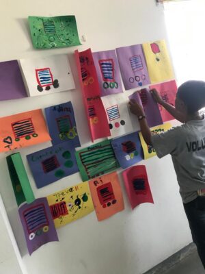 Centre Administrator at The Source, Savanna-la-Mar, Heather Blake mounting art pieces done by the students of the Y’s Menettes summer camp to their arts and craft wall. Craft items were also donated by the Sandals Foundation in an effort to assist with the creative learning vision of the camp administrators. 