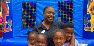 Debbian Anderson from the Beaches Negril stewarding team posed for a quick picture with her children as they got ready to join in on the fun at the resort’s family fun day.