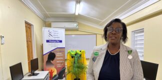 Dawn Smith, General Manager of Sandals Royal Caribbean, representing the Sandals Foundation, showing off a section of the newly refurbished computer lab at the Women’s Centre of Jamaica in Montego Bay.