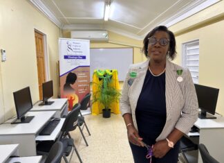 Dawn Smith, General Manager of Sandals Royal Caribbean, representing the Sandals Foundation, showing off a section of the newly refurbished computer lab at the Women’s Centre of Jamaica in Montego Bay.