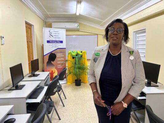 Dawn Smith, General Manager of Sandals Royal Caribbean, representing the Sandals Foundation, showing off a section of the newly refurbished computer lab at the Women’s Centre of Jamaica in Montego Bay.