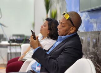 Dr Mark Bynoe and colleague at the Caribbean Community Climate Change Centre, Ethlyn Valladeres, take a breather in the Caribbean Pavilion at the UN Climate Talks which got underway in Egypt today (Monday, November 7, 2022).