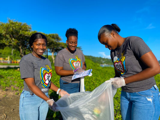 (From left) Sandals and Beaches Negril team members Kimberly Williams, Monique Munroe and Olivier Bowen ensured they were getting the correct total of plastic bottles being collected to assist in providing useful data at the resorts’ International Coastal Cleanup Day initiative at Johnson Town Beach in Hanover.