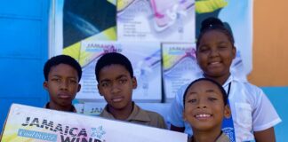 (From left) Broughton Primary School students Amari Whyte, Rodger Williams Anise Anderson and Jordan Subaxon were elated to receive fans for their classrooms donated by the Sandals Foundation.