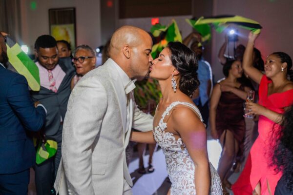 Steven and Christie steal a sweet kiss in the midst of their wedding celebrations.