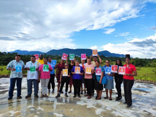 A key part of the assessments done in the twenty communities explored awareness of the Sustainable Development Goals (SDGs) and actions being done to incorporate them into community development. Here indigenous people from the Surama Village in Guyana share cards with the 17 SDGs.