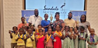 General Manager at Sandals South Coast, O’Brian Heron (second left) was pleased to share in the moment with the Inter-School Literacy competitors and teachers.