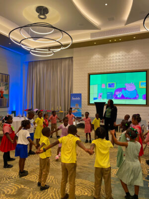 Teacher from Beeston Spring Early Childhood, Sheree Reid playing a round of ring games with the students to shake the nervousness before their respective competitions.