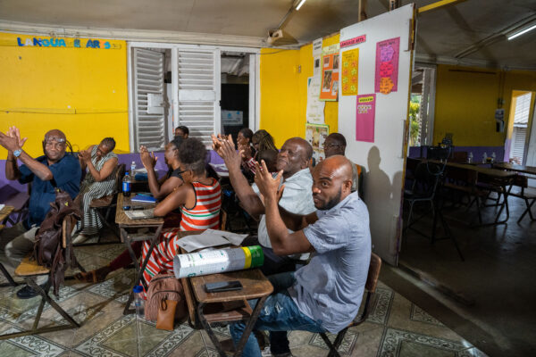 Participants at Pisgah Primary School in St. Elizabeth, Jamaica, applaud a point made during a series of beneficiary assessment meetings conducted by the Caribbean Development Bank’s Basic Needs Trust Fund.