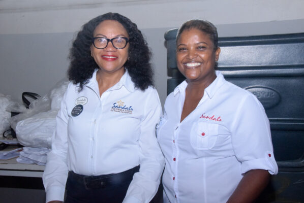 Shernet Bailey (left) manager at the Sandals Central Laundry and Assistant Manager Sonita Danhi pause from their leadership duties as they share a moment with the camera