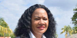 Shernet Bailey (left) manager at the Sandals Central Laundry and Assistant Manager Sonita Danhi pause from their leadership duties as they share a moment with the camera