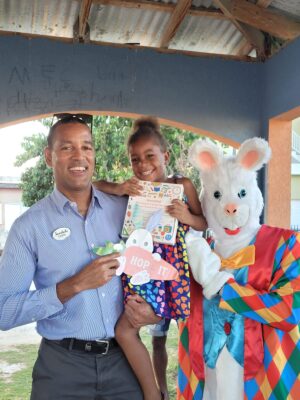 General Manager of Sandals Montego Bay Christopher Elliott happily poses for a picture with the Easter bunny and four-year-old Deneisha McFarlane of Whitehouse.